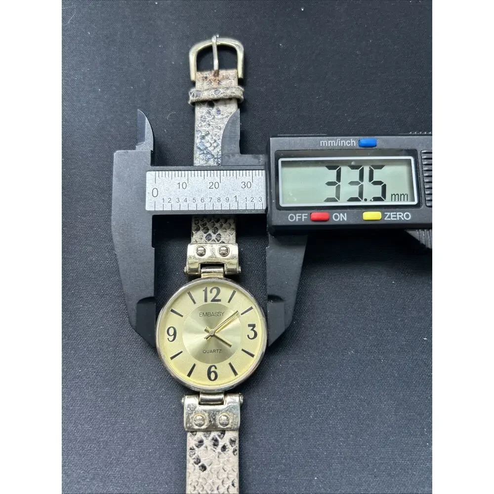Embassy Gold Tone Snakeskin Type Band Women’s Quartz Watch